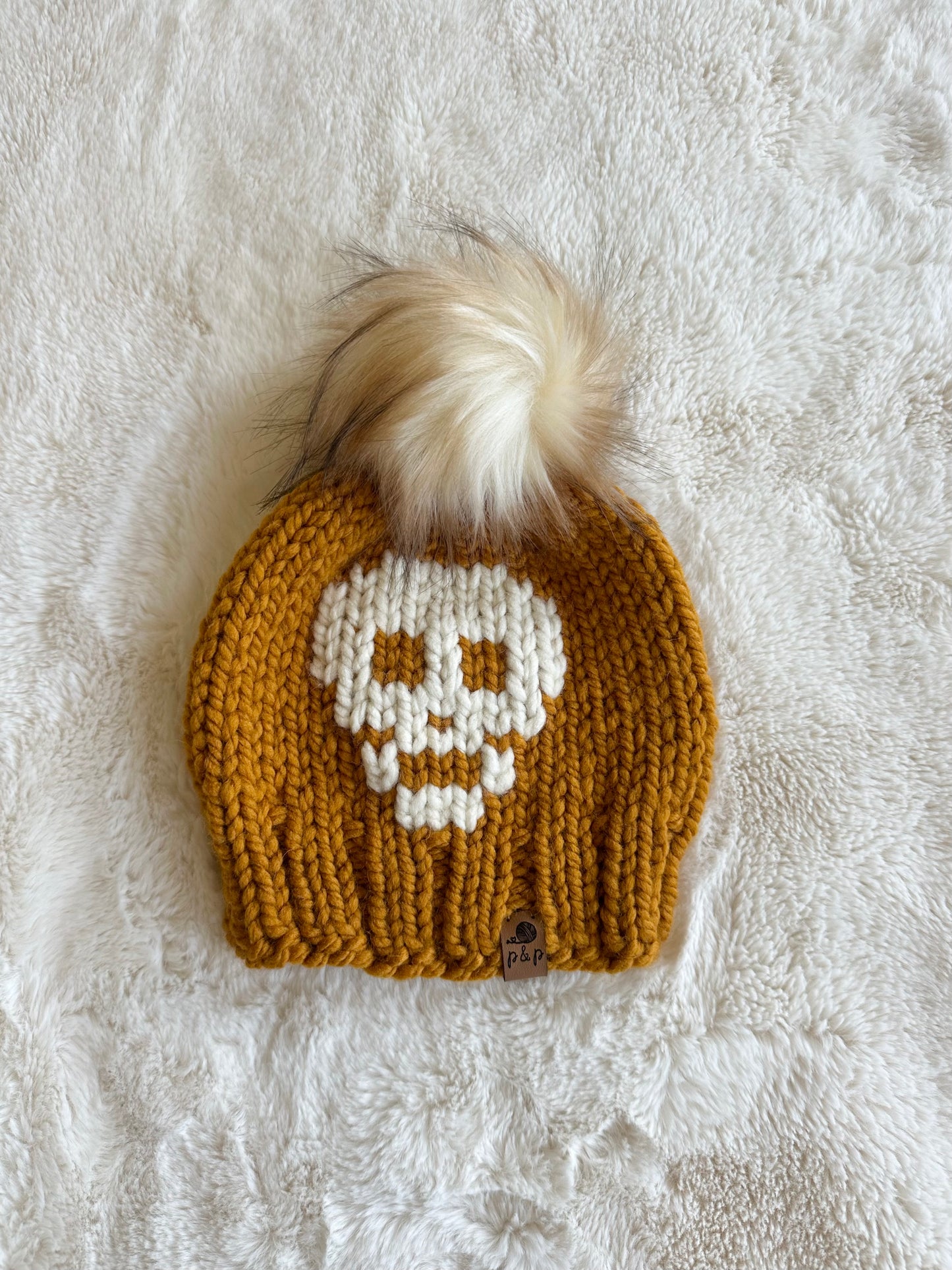 Toddler skull in butterscotch + cream